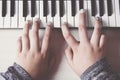 Beautiful girls hands playing electronic piano keyboards. Royalty Free Stock Photo