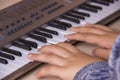 Beautiful girls hands playing electronic piano keyboards. Royalty Free Stock Photo