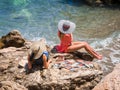 Beautiful girls in hats sunbathing Royalty Free Stock Photo