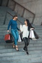 Beautiful girls with paper bags outside shopping mall Royalty Free Stock Photo