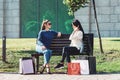 Beautiful girls with paper bags outside shopping mall Royalty Free Stock Photo