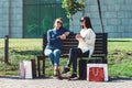 Beautiful girls with paper bags outside shopping mall Royalty Free Stock Photo