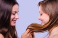 Beautiful girls playing with their hair Royalty Free Stock Photo