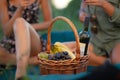 Beautiful girls tasting wine in a field near vineyard field. Celebrating successful harvest season. Couple having a romantic date Royalty Free Stock Photo