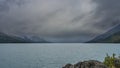 A beautiful glacial lake is surrounded by mountains. Royalty Free Stock Photo