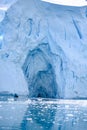 Glacier wall in Antarctica, majestic blue and white ice wall with shape of arch.