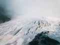 Beautiful glaciers flow through the mountains in Iceland. Aerial view and top view. Royalty Free Stock Photo