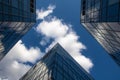 Beautiful glass buildings against a blue sky with clouds. Modern architecture. High perspective. Royalty Free Stock Photo