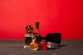 Beautiful glass jars with perfume on a red background Royalty Free Stock Photo