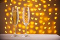 beautiful glasses of champagne on a blurred background of hearts