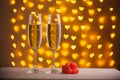 Beautiful glasses of champagne on a blurred background of hearts