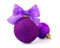 Beautiful glittering purple christmas balls with bright ribbon