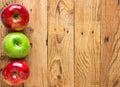 Beautiful Glossy Red Green Apples on Aged Plank Barn Wood Background. Autumn Fall Harvest Thanksgiving Concept. Rustic Vintage Royalty Free Stock Photo