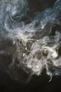 Beautiful glowing smoke from incense sticks and burning incense on a black background. Background for advertising and Royalty Free Stock Photo