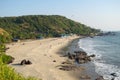 Beautiful Goa beach, sandy coast, rocky stones and sea high view and people at holiday in India, arambol, sweet lake Royalty Free Stock Photo