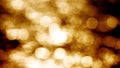 Beautiful gold abstract glittering lights bokeh background. Glistening and shimmering ocean surface at sunset Royalty Free Stock Photo