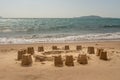 Beautiful gold ocean beach with yellow sand with Castle and towers is in the photo Royalty Free Stock Photo