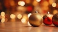 Beautiful gold and red Christmas balls on warm tone of bokeh background, close-up, copy space, selective focus Royalty Free Stock Photo