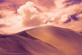 Beautiful gold sand dunes with bright clouds in the Namib desert