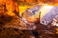 Beautiful gold sunlight shining to Sung Sot Cave or Surprise Grotto on Bo Hon Island is finest and widest grottoes of Ha Long Bay