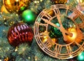 Beautiful gold watch jewelry. toys hanging on a traditional Christmas tree. Background of New Year Royalty Free Stock Photo