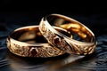 Beautiful gold wedding rings with red rubies Royalty Free Stock Photo