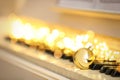 Beautiful golden bauble and fairy lights on piano keys, space for text. Christmas music Royalty Free Stock Photo