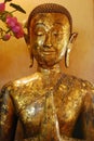 The beautiful Golden Buddha statue in Buddhist temple.