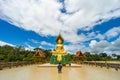 Beautiful Golden Buddha statue with Naga at Wat Phra Bueng Khao Luang, Ubon Ratchathani Province, Thailand