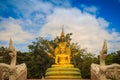 Beautiful golden Buddha statue with seven Phaya Naga heads under Royalty Free Stock Photo