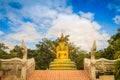 Beautiful golden Buddha statue with seven Phaya Naga heads under Royalty Free Stock Photo