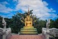 Beautiful golden Buddha statue with seven Phaya Naga heads under Royalty Free Stock Photo