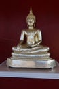 beautiful golden buddha in thai temple red wall background faith buddhism Royalty Free Stock Photo