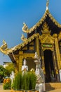 Beautiful golden Buddhist church in Lanna style architecture at Wat Inthakin Sadue Muang, Chiang Mai, Thailand. Wat Inthakin is th Royalty Free Stock Photo