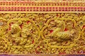 Beautiful golden carving of the mythical singha or lion on the sanctuary Buddhist church wall at Wat Srisupan, Chiang Mai, Royalty Free Stock Photo