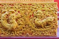 Beautiful golden carving of the mythical singha or lion on the sanctuary Buddhist church wall at Wat Srisupan, Chiang Mai, Royalty Free Stock Photo
