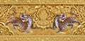 Beautiful golden carving of the mythical tiger on the sanctuary Buddhist church wall