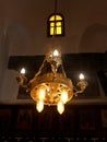 Beautiful golden Chandelier shining and hanging from the ceiling in Meharak monastery in kousya in Assuit