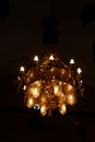 Beautiful golden Chandelier shining and hanging from the ceiling in Meharak monastery in kousya in Assuit