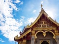 Beautiful golden chapel of temple with a backdrop of blue sky