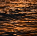 Beautiful golden colors of sunset over sea waves Royalty Free Stock Photo