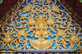 Beautiful golden gable chapel with engraved angel sculpture. An Royalty Free Stock Photo