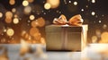 Beautiful golden gift box on the light table against blurred festive lights bokeh background Royalty Free Stock Photo