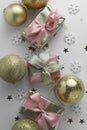 Beautiful golden gifts gloden baubles on white. Christmas, party, birthday background. Celebrate shinny surprise boxes copy space Royalty Free Stock Photo