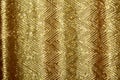 Beautiful golden glitter background with golden sequins. Sparkling sequined textile