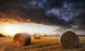 Beautiful golden hour hay bales sunset landscape Royalty Free Stock Photo