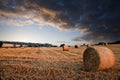 Beautiful golden hour hay bales sunset landscape Royalty Free Stock Photo