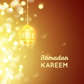 Beautiful Golden lamp , Ramadan Kareem greeting on gold bokeh background