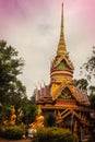 Beautiful golden pagoda with decorative Thai style fine art at public Buddhist Wat Phu Phlan Sung temple, Nachaluay, Ubon Ratchath Royalty Free Stock Photo