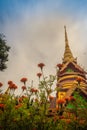 Beautiful golden pagoda with decorative Thai style fine art at public Buddhist Wat Phu Phlan Sung temple, Nachaluay, Ubon Ratchath Royalty Free Stock Photo